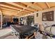 Covered patio featuring a pool table and seating, leading to the backyard area at 251 Las Palmaritas Dr, Las Vegas, NV 89110