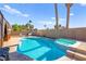 Backyard pool and spa surrounded by desert landscaping at 251 Las Palmaritas Dr, Las Vegas, NV 89110