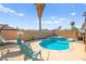 Backyard pool and spa area with lounge chairs and palm trees, perfect for outdoor relaxation at 251 Las Palmaritas Dr, Las Vegas, NV 89110