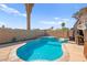 Backyard pool and spa featuring tropical landscaping and space for outdoor seating at 251 Las Palmaritas Dr, Las Vegas, NV 89110