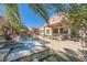 Beautiful backyard with a pool, spa, and covered patio area at 280 Goldstar St, Henderson, NV 89012