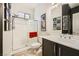 Modern bathroom features glass enclosed shower and dark cabinets at 280 Goldstar St, Henderson, NV 89012