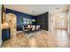 Open dining room featuring a modern light fixture, tiled flooring and a beautiful accent wall at 280 Goldstar St, Henderson, NV 89012