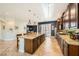Open kitchen with a large island, tile floors, and stainless steel appliances at 280 Goldstar St, Henderson, NV 89012