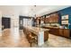 Gourmet kitchen featuring a center island with seating, custom cabinetry, and modern lighting at 280 Goldstar St, Henderson, NV 89012