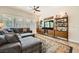Spacious living room featuring a comfortable sectional sofa, stylish rug, and modern shelving at 280 Goldstar St, Henderson, NV 89012