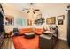 Cozy office with a large area rug, sectional couch, and ceiling fan at 280 Goldstar St, Henderson, NV 89012