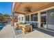 Covered patio area with outdoor seating, overlooking the backyard pool at 280 Goldstar St, Henderson, NV 89012