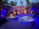 Backyard pool and jacuzzi at night with custom lighting at 280 Goldstar St, Henderson, NV 89012