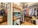 Organized walk-in closet featuring custom shelving and ample storage space at 280 Goldstar St, Henderson, NV 89012