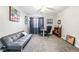 Versatile room with a futon, desk, and ample lighting, ideal for a home office or guest room at 2851 S Valley View Blvd # 1044, Las Vegas, NV 89102