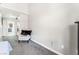 Neutral carpeted bedroom with a comfortable chair, with access to a wardrobe and bathroom at 2851 S Valley View Blvd # 1044, Las Vegas, NV 89102