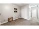Bedroom with neutral colored walls, carpet, white closet door and a view of the Primary bathroom at 2851 S Valley View Blvd # 1044, Las Vegas, NV 89102