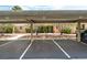 View of a covered carport with assigned parking spaces and well-maintained landscaping at 2851 S Valley View Blvd # 1044, Las Vegas, NV 89102