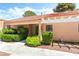 Attractive condo with covered porch, desert landscaping, manicured shrubbery and tile roof at 2851 S Valley View Blvd # 1044, Las Vegas, NV 89102