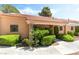 Attractive condo with covered porch, column, desert landscaping, manicured shrubbery and tile roof at 2851 S Valley View Blvd # 1044, Las Vegas, NV 89102