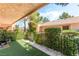 Relaxing patio with artificial turf, privacy screen, and covered area for enjoying the outdoors at 2851 S Valley View Blvd # 1044, Las Vegas, NV 89102