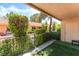 Relaxing covered patio with artificial turf and privacy screen, perfect for enjoying the outdoors at 2851 S Valley View Blvd # 1044, Las Vegas, NV 89102