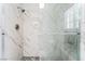 Bathroom shower with modern shower head, glass door and marbled tile at 2851 S Valley View Blvd # 1044, Las Vegas, NV 89102