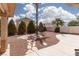 Landscaped backyard features a stone walkway, desert landscaping, and a covered patio at 3522 Shonna Way, North Las Vegas, NV 89032