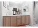 Well-lit bathroom features a dual-sink vanity and a toilet with a shower-tub combo at 3522 Shonna Way, North Las Vegas, NV 89032