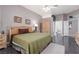 Main bedroom with an en-suite bathroom, closet, and a gray accent wall at 3522 Shonna Way, North Las Vegas, NV 89032