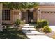 Charming home features a stone walkway, well-maintained landscaping, and a covered entrance at 3522 Shonna Way, North Las Vegas, NV 89032