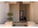 Inviting covered front porch with decorative iron gate and custom door at 3522 Shonna Way, North Las Vegas, NV 89032