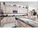 Kitchen featuring granite countertops, white cabinets, and stainless steel appliances offering both style and functionality at 3522 Shonna Way, North Las Vegas, NV 89032