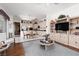 Open living room and kitchen featuring tile floors, lots of natural light, and a spacious design for comfortable everyday living at 3522 Shonna Way, North Las Vegas, NV 89032