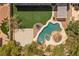 Aerial view of backyard with pool, spa, landscaping and lounge areas at 358 Whispering Tree Ave, Las Vegas, NV 89183