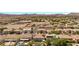 Scenic aerial view of the community featuring rooftops, pools, and palm trees at 358 Whispering Tree Ave, Las Vegas, NV 89183