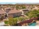 Beautiful backyard featuring a custom pool, well-maintained lawn, and lush landscaping at 358 Whispering Tree Ave, Las Vegas, NV 89183