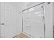 Bright bathroom featuring a shower with a glass door enclosure at 358 Whispering Tree Ave, Las Vegas, NV 89183