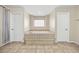 Bathroom featuring a soaking tub with tile surround at 358 Whispering Tree Ave, Las Vegas, NV 89183