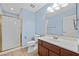 Clean bathroom featuring a shower and vanity with blue walls at 358 Whispering Tree Ave, Las Vegas, NV 89183