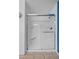 Updated shower with white tiles and glass enclosure at 358 Whispering Tree Ave, Las Vegas, NV 89183