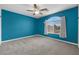 Inviting bedroom with a ceiling fan and ample natural light at 358 Whispering Tree Ave, Las Vegas, NV 89183