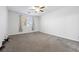 Bedroom with large window and neutral colored carpet at 358 Whispering Tree Ave, Las Vegas, NV 89183