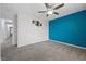 Bedroom with a ceiling fan, gray carpeting, and an accent wall at 358 Whispering Tree Ave, Las Vegas, NV 89183