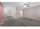 Spacious bedroom featuring neutral tones, plush carpeting, and a ceiling fan for added comfort at 358 Whispering Tree Ave, Las Vegas, NV 89183