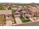 Elegant two-story home featuring a landscaped front yard, dual garages, and a solar panel roof at 358 Whispering Tree Ave, Las Vegas, NV 89183