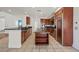 This kitchen offers granite counters, stainless appliances, center island with storage and tile floors at 358 Whispering Tree Ave, Las Vegas, NV 89183