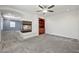 Open living area showcases a fireplace, built-in shelves, and neutral carpeting at 358 Whispering Tree Ave, Las Vegas, NV 89183