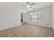 Open living room with tile floors, large windows, and natural light at 358 Whispering Tree Ave, Las Vegas, NV 89183