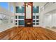 Spacious living room with a fireplace, hardwood floors, built in shelves and high ceilings at 358 Whispering Tree Ave, Las Vegas, NV 89183