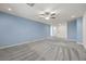 Spacious living room featuring plush carpets and ample natural light at 358 Whispering Tree Ave, Las Vegas, NV 89183