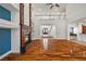 An open concept floor plan showcases a hardwood floor and a fireplace at 358 Whispering Tree Ave, Las Vegas, NV 89183