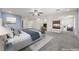 An open and airy primary bedroom features a fireplace and an attached seating area for relaxing and unwinding at 358 Whispering Tree Ave, Las Vegas, NV 89183