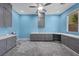 Spacious office featuring built in cabinetry and neutral colored carpet flooring at 358 Whispering Tree Ave, Las Vegas, NV 89183